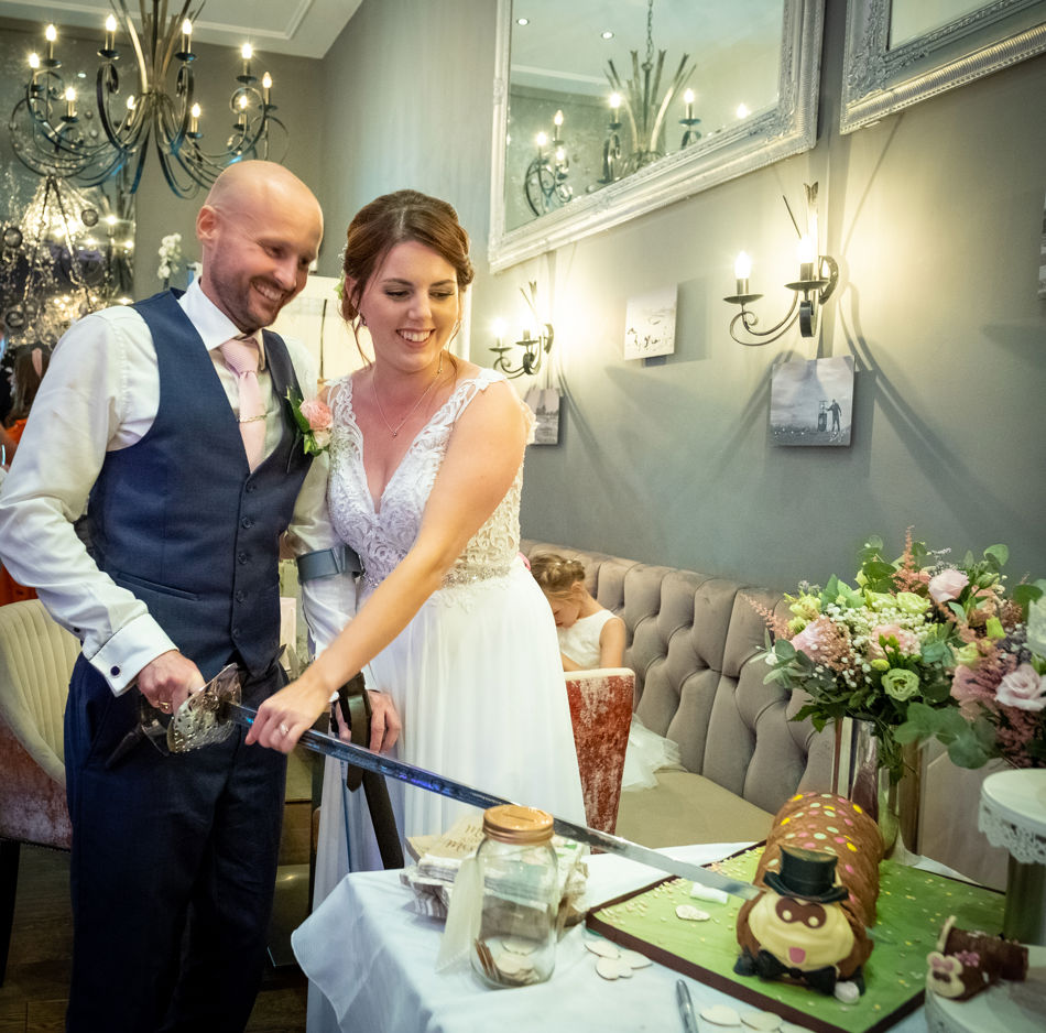 Mr and Mrs Hooper cake cutting.jpg